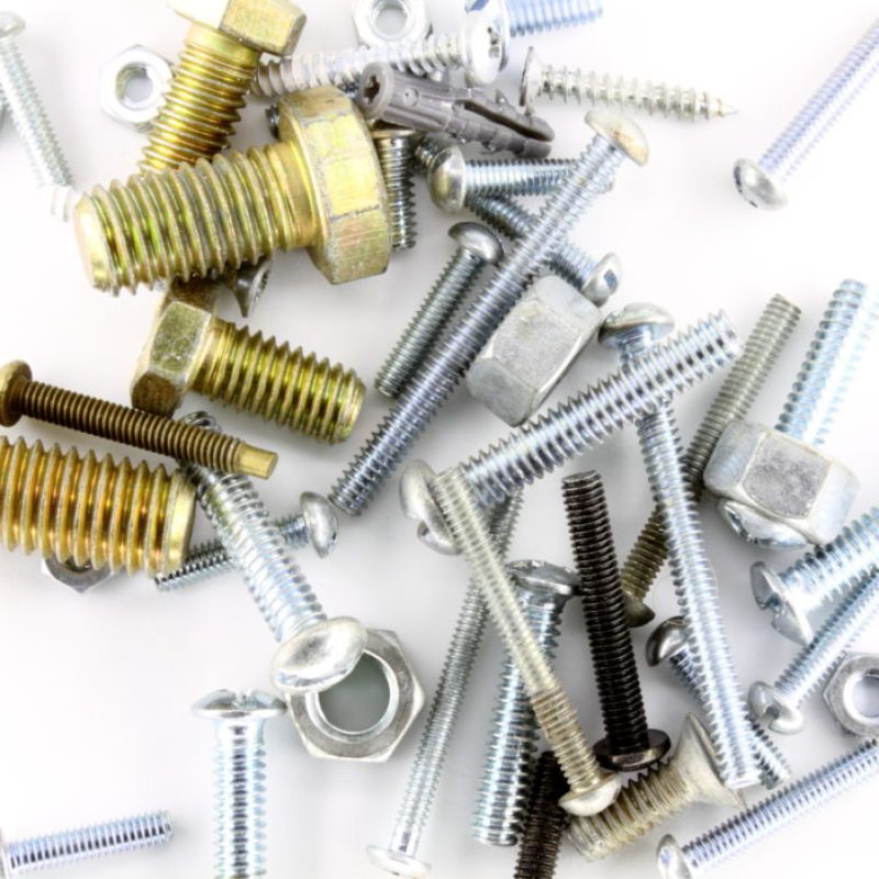 Various bolts and screws on white background